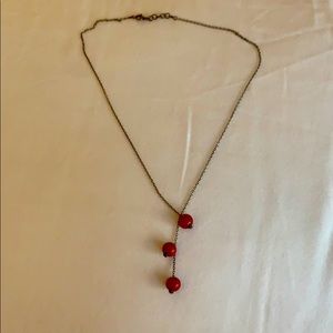 Short necklace with hanging red beads